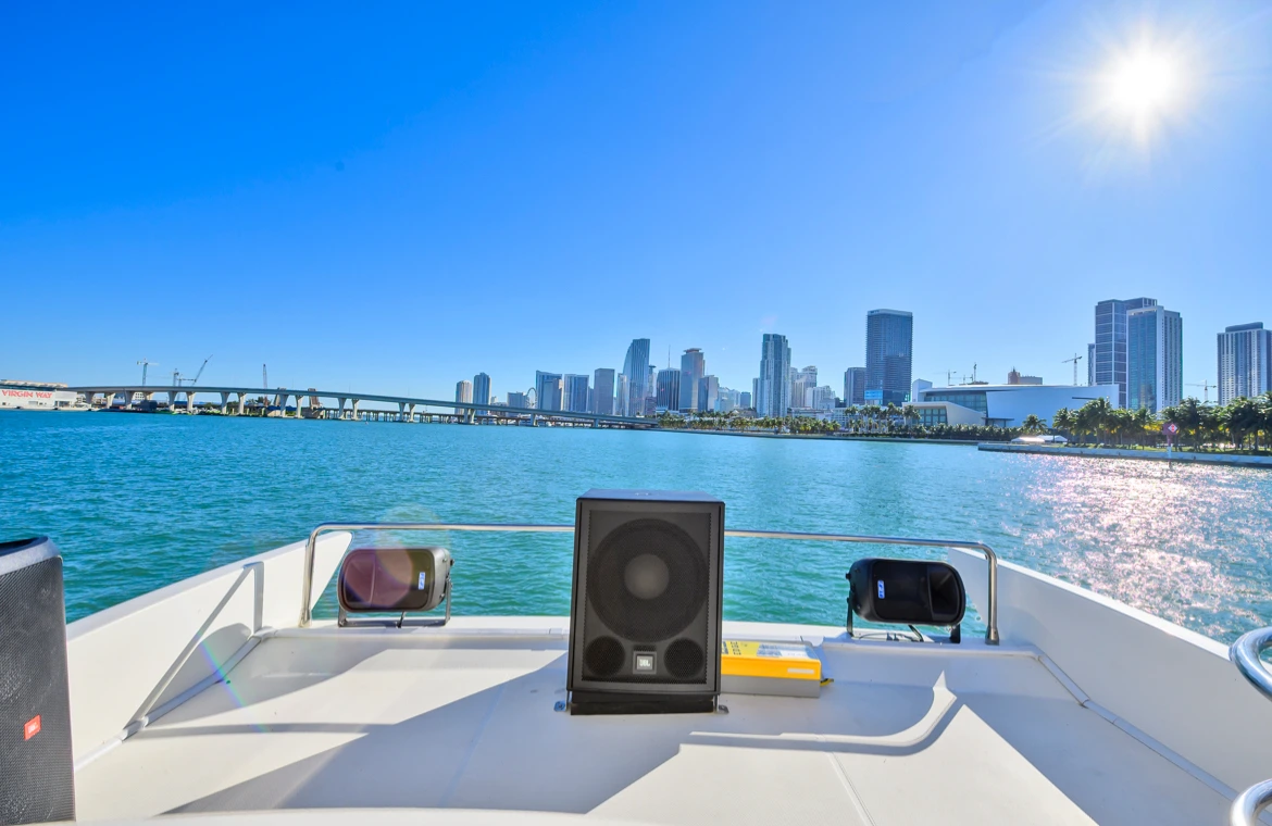 Yacht’s rear speakers with a stunning view of the Miami
  skyline.
